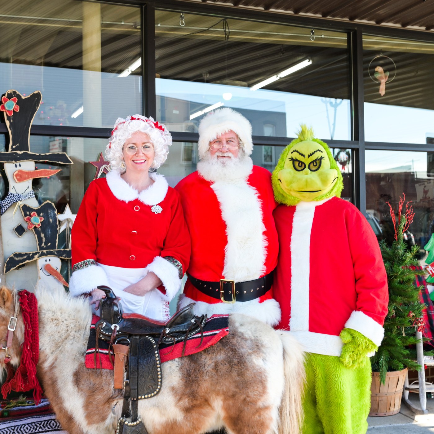 Santa, Mrs. Claus, and the Grinch at the Litchfield Christmas Parade in front of The Briar Rose